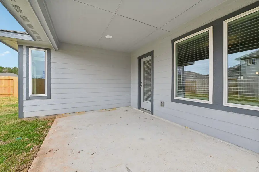 Exterior details and patio area of a home in , Conroe (Image 4).