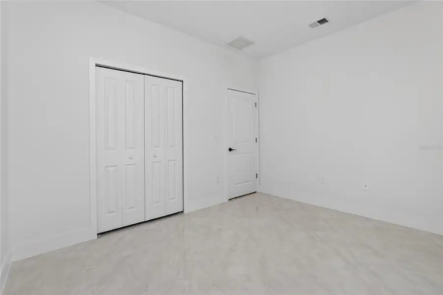 Spacious, unfurnished interior of a new home in , Port Charlotte (Image 57).