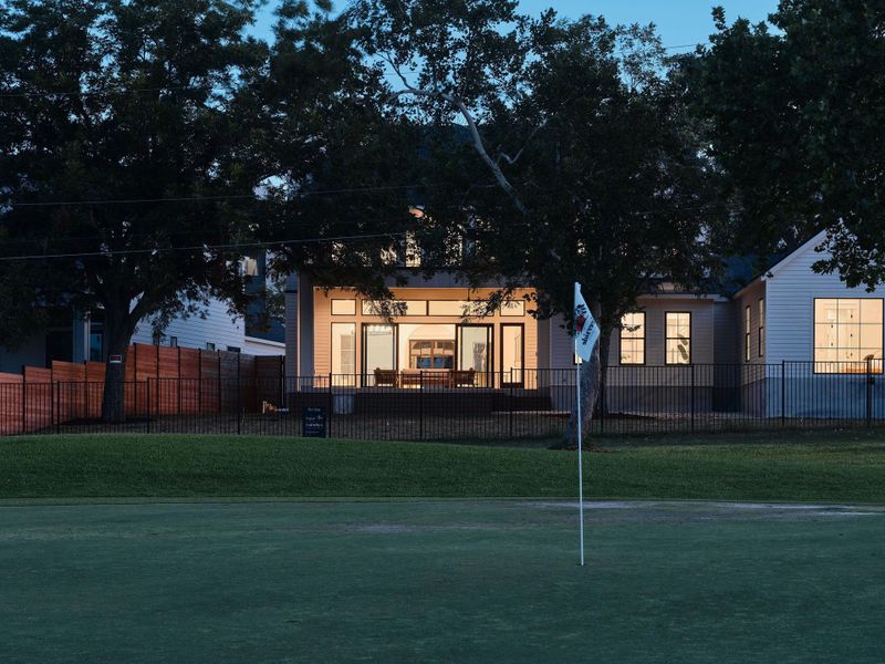 View of front facade featuring a putting green View of front facade featuring a putting green