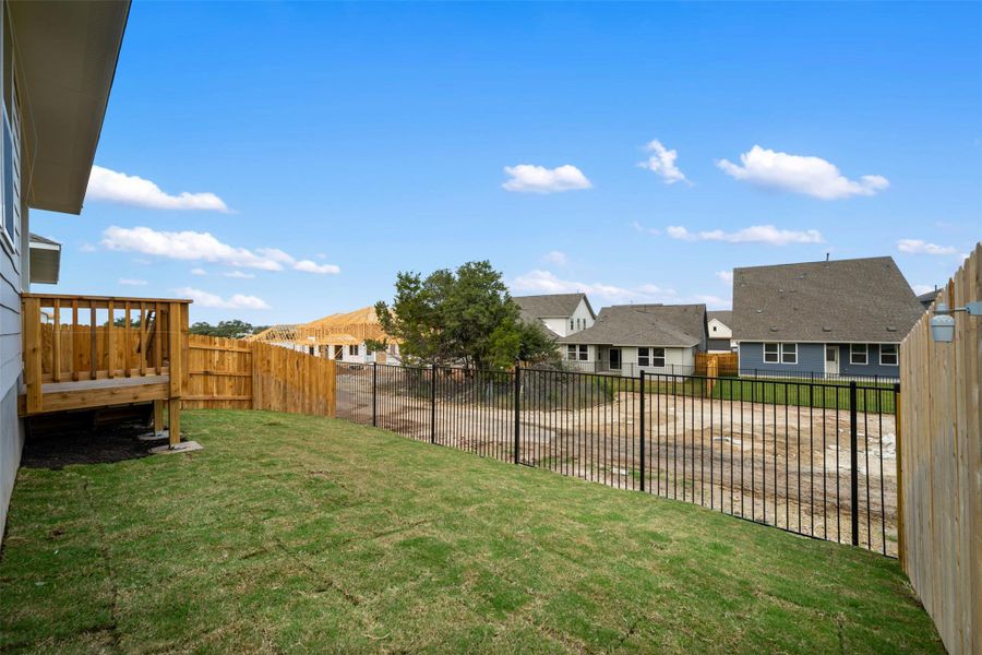 Exterior details and patio area of a home in Cannon Ranch 40s, Dripping Springs (Image 2).