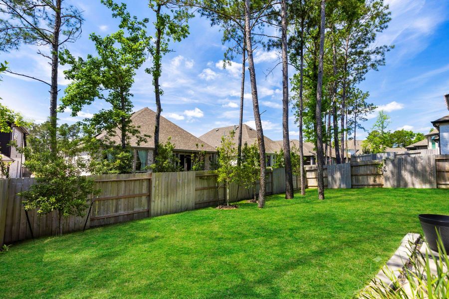 Exterior details and patio area of a home in Woodforest, Montgomery (Image 4).