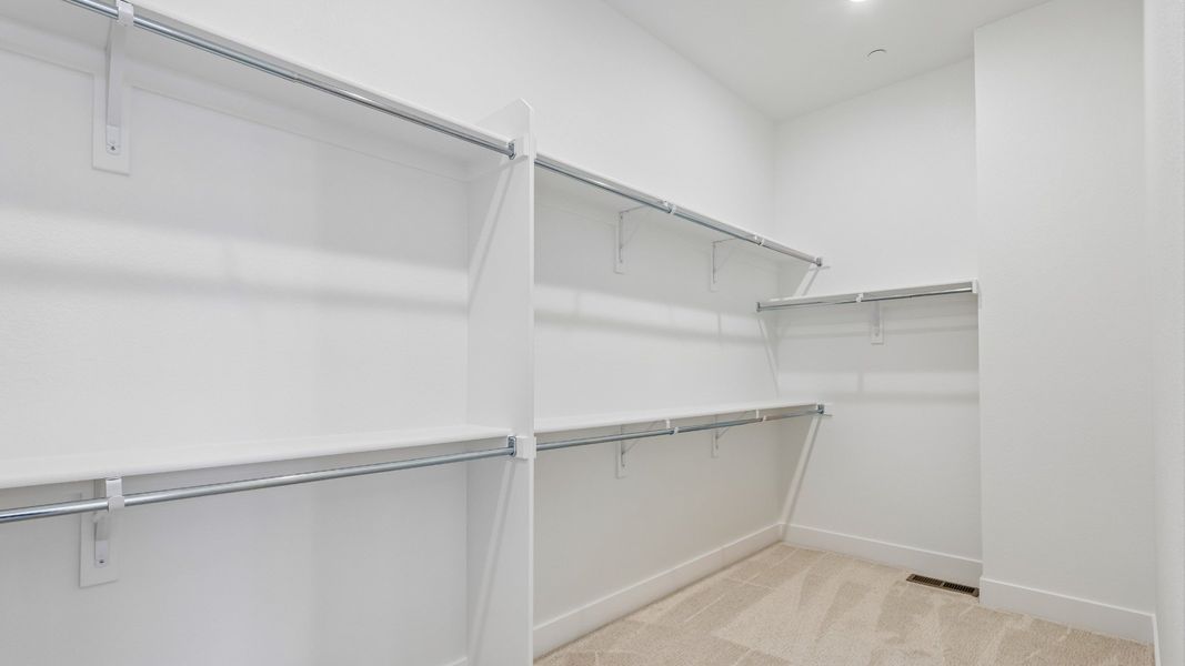 Generous walk-in closet helps keep everyday essentials organized Generous walk-in closet helps keep everyday essentials organized
