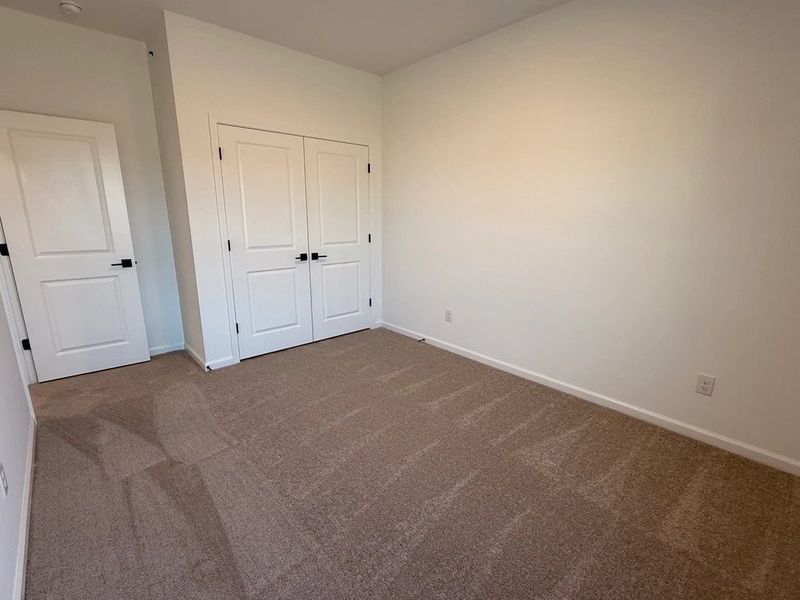 Bedroom 3 featuring AW Collection® Oxford -  Natural tones and timeless comfort.