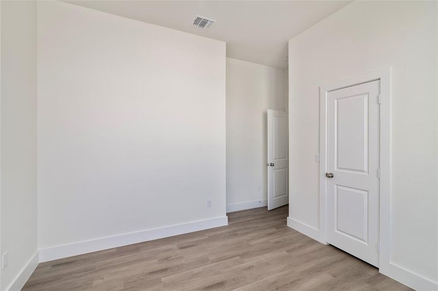 Spare room with light wood-type flooring