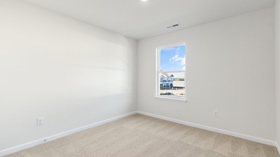 Spacious, unfurnished interior of a new home in The Townes at Honeycutt Oaks, Angier (Image 17).