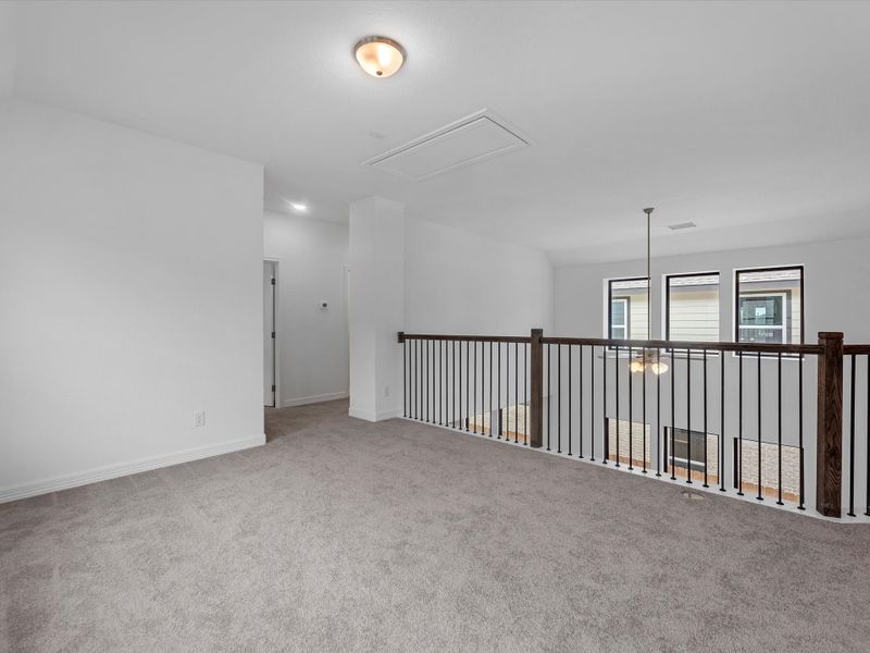 Upstairs loft. Sample product photo. Actual exterior and interior selections may vary by homesite. Photo may be virtually staged.