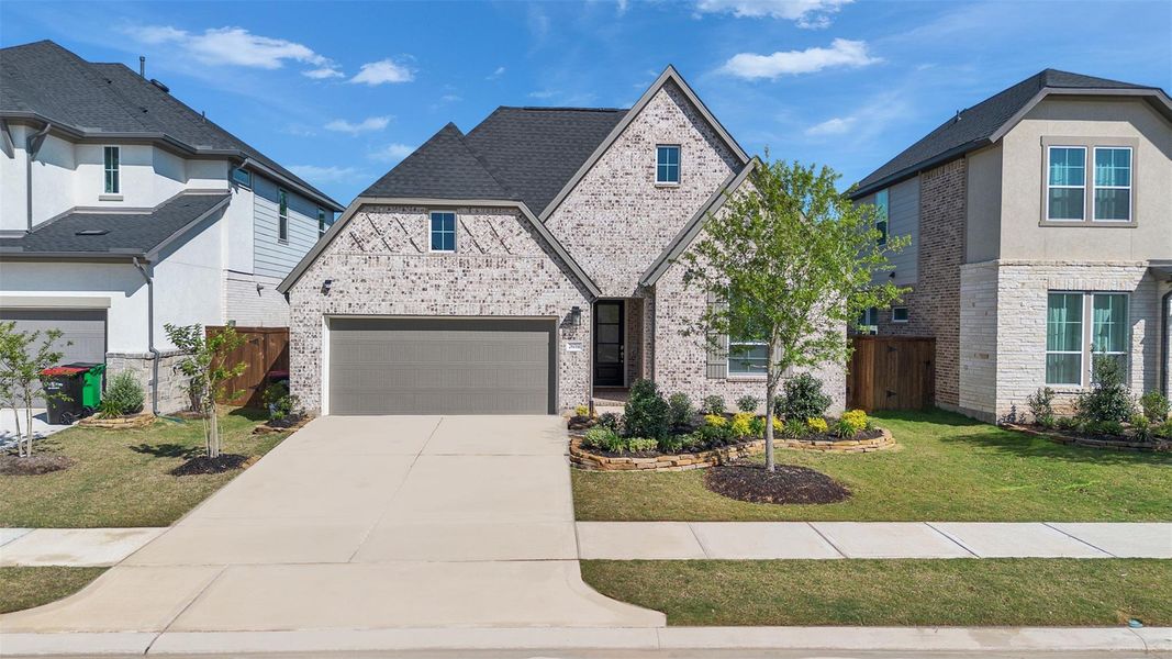 Front exterior of a new home in Tompkins Reserve, Katy, TX, highlighting curb appeal (Image 23).