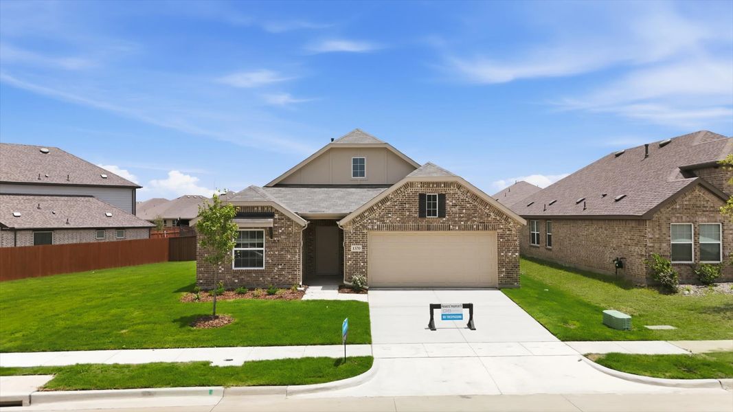 Front exterior of a new home in Walden Pond, Forney, TX, highlighting curb appeal (Image 22). Front exterior of a new home in Walden Pond, Forney, TX, highlighting curb appeal (Image 22).