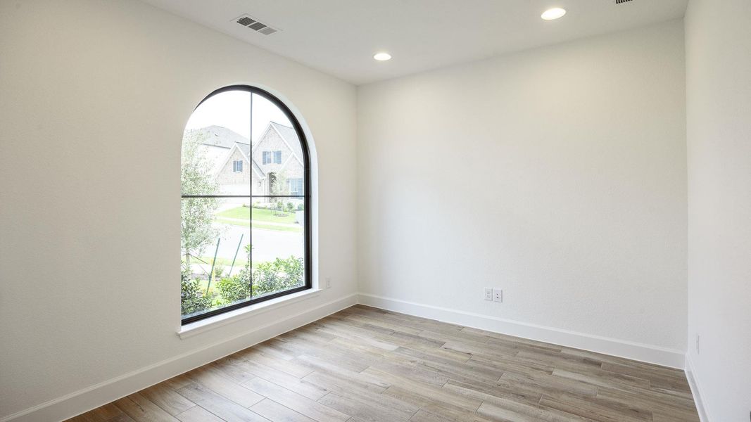 Unfurnished room with light wood finished floors and recessed lighting