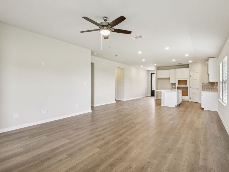 Dining and kitchen in the Oleander floorplan at a Meritage Homes community.