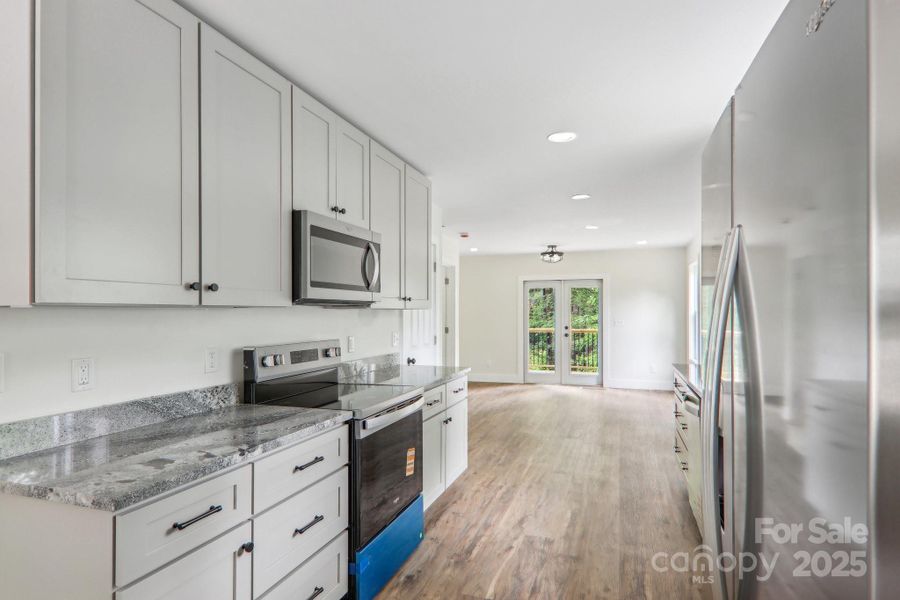 Furnished interior view inside a new home in , Waynesville (Image 9).