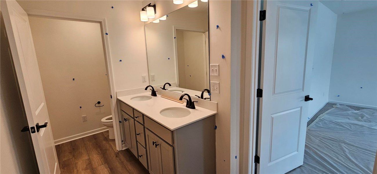 This modern bathroom features a double vanity and