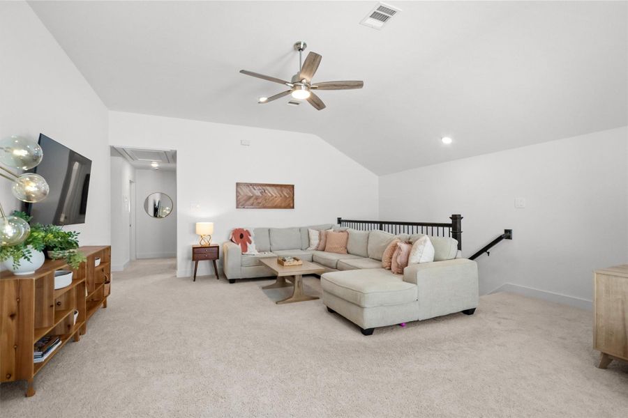 Versatile upstairs game room offers plenty of space to make it your own—perfect for movie nights, a playroom, home gym, second living area, or a relaxing retreat for family and guests.