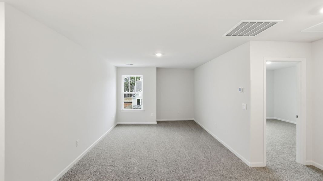 Spacious, unfurnished interior of a new home in Durbin Meadows Traditions, Fountain Inn (Image 23).