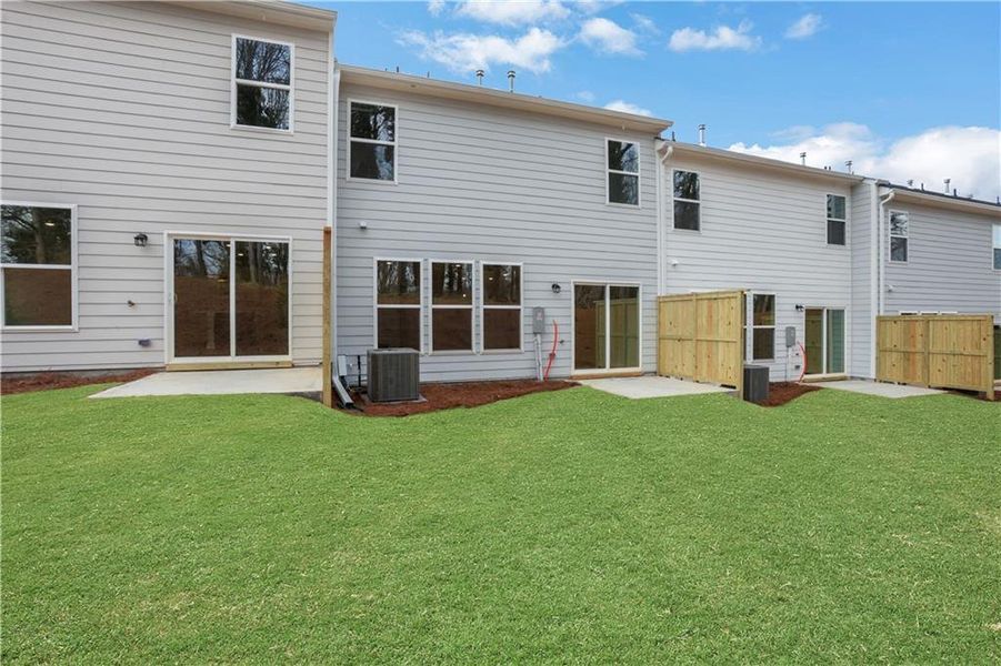 Exterior details and patio area of a home in Villas at Dawsonville Townhomes, Dawsonville (Image 3).