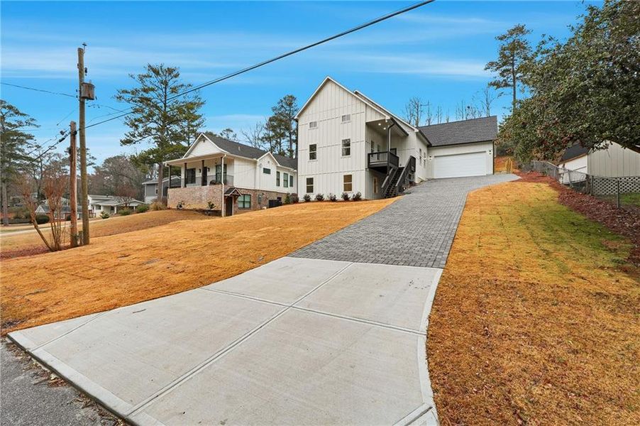 Front exterior of a new home in , Smyrna, GA, highlighting curb appeal (Image 1). Front exterior of a new home in , Smyrna, GA, highlighting curb appeal (Image 1).