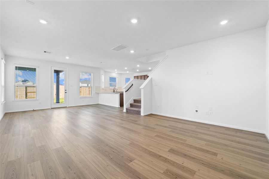 Beautiful open-concept layout effortlessly uniting the living, dining, and kitchen spaces—ideal for everyday comfort and entertaining guests!