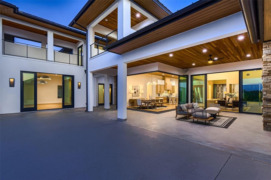 This property features a spacious outdoor patio with a wooden ceiling and recessed lighting, providing ample space for outdoor enjoyment