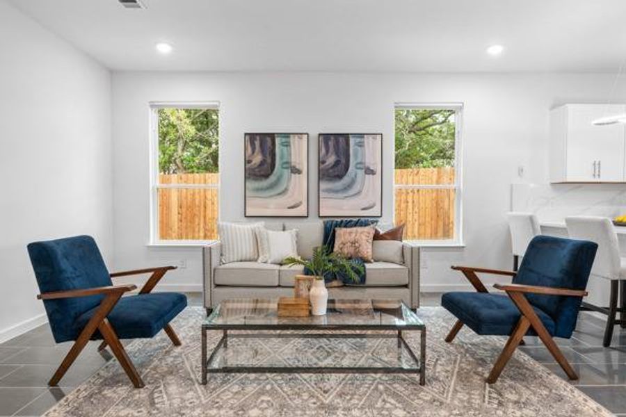 Sitting room featuring tile patterned flooring and recessed lighting Sitting room featuring tile patterned flooring and recessed lighting