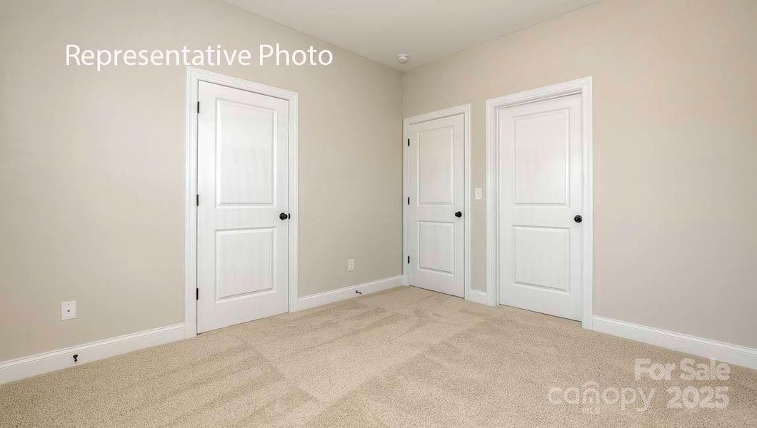 Spacious, unfurnished interior of a new home in Sanctuary at Southgate, Indian Trail (Image 32).