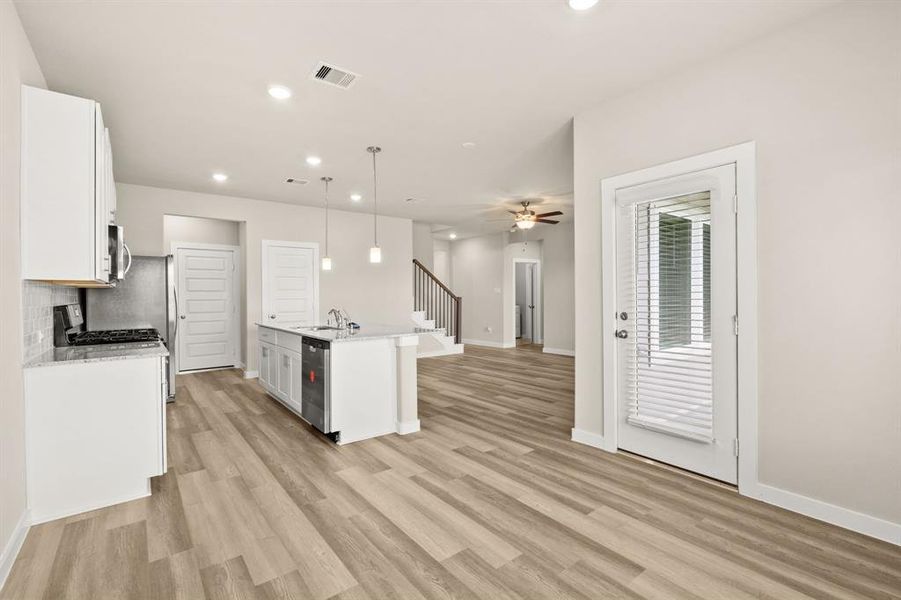 Adjacent to the kitchen, the breakfast area provides a comfortable and casual dining space within the home.