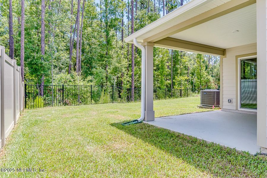 Front exterior of a new home in Anabelle Island - Classic Series, Green Cove Springs, FL, highlighting curb appeal (Image 14).