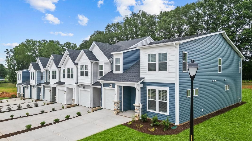 Front exterior of a new home in Aspen Ridge, Lyman, SC, highlighting curb appeal (Image 18).