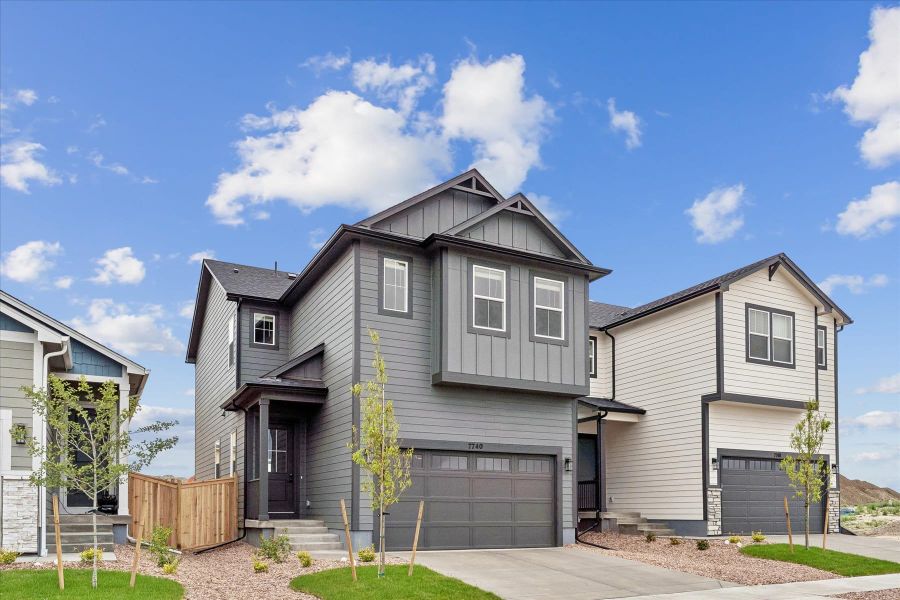 Front exterior of a new home in Aspen Meadows, Colorado Springs, CO, highlighting curb appeal (Image 1). Front exterior of a new home in Aspen Meadows, Colorado Springs, CO, highlighting curb appeal (Image 1).