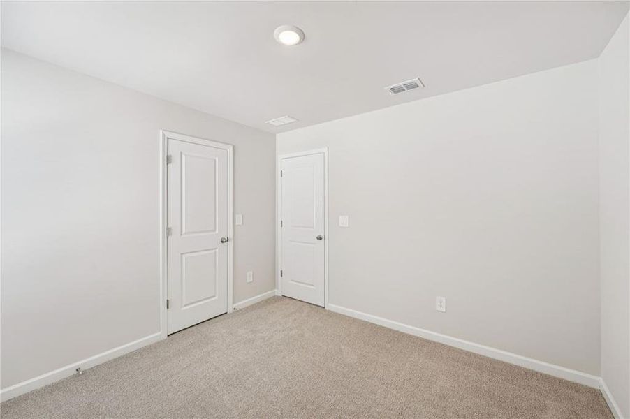 Spacious, unfurnished interior of a new home in Creekside at Oxford Park, Fairburn (Image 42).