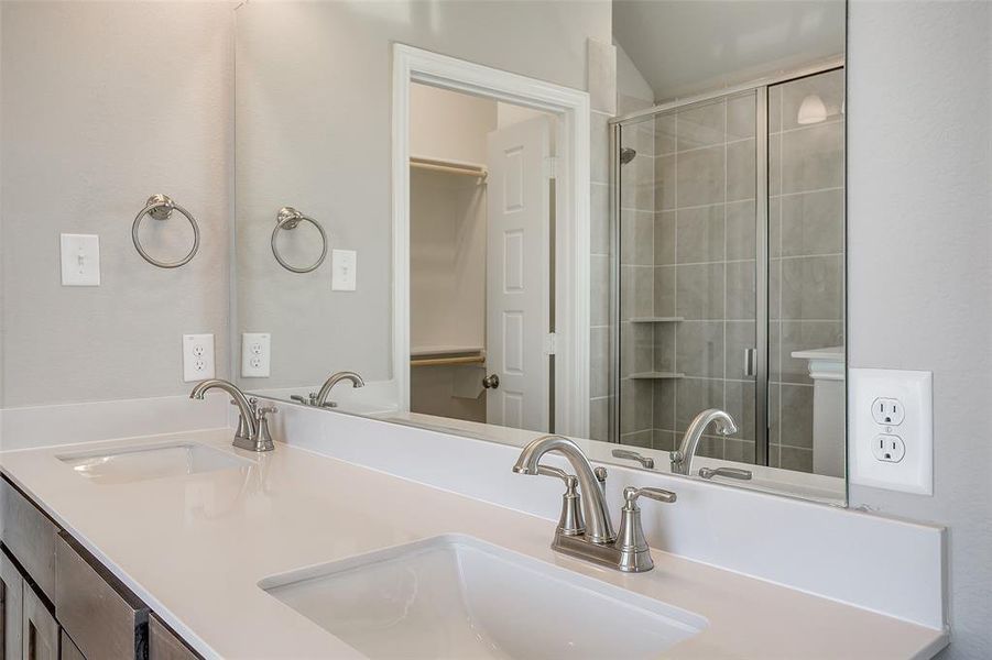 Bathroom featuring walk in shower and vanity Bathroom featuring walk in shower and vanity