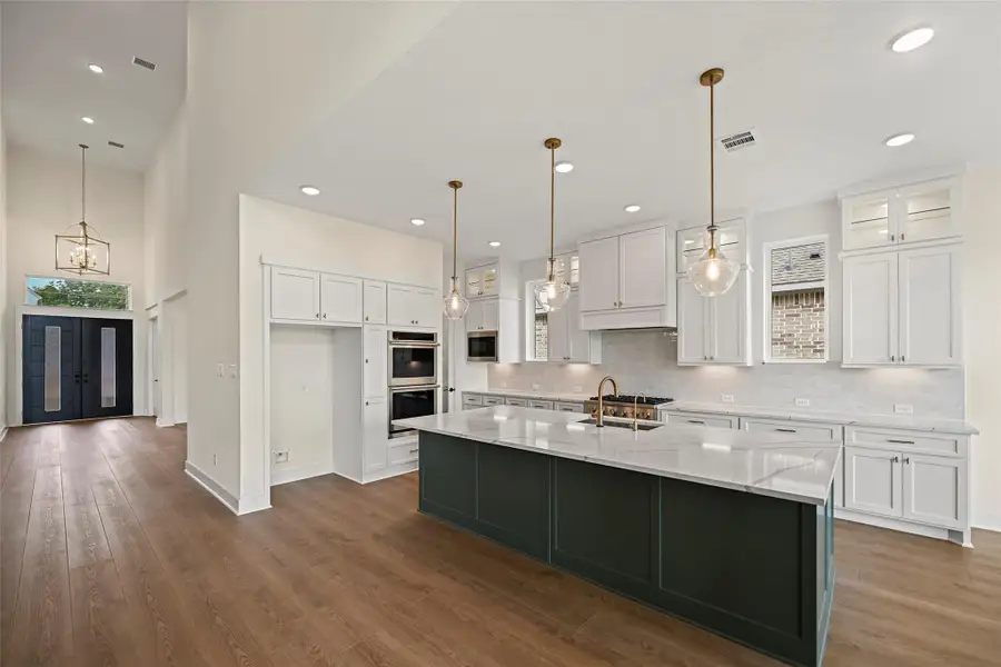 Furnished interior view inside a new home in Bridgeland 80′, Cypress (Image 5).