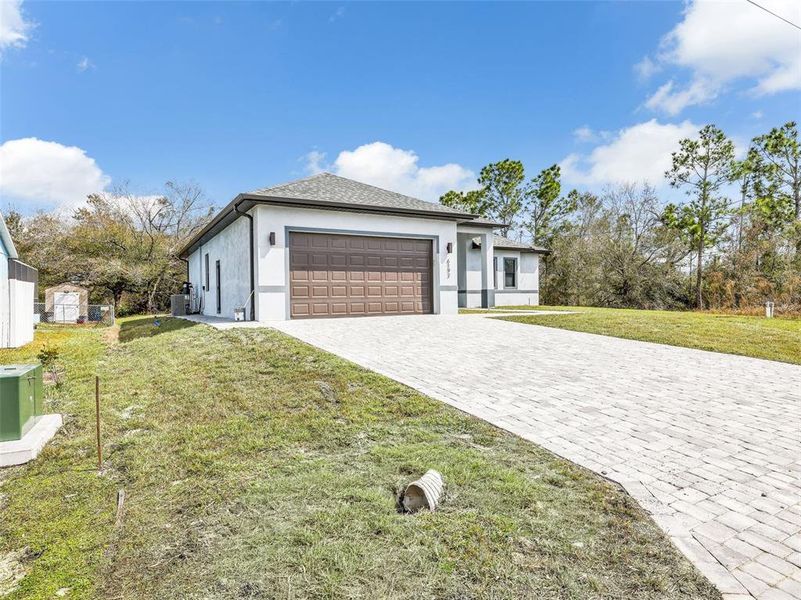 Front exterior of a new home in , Port Charlotte, FL, highlighting curb appeal (Image 26).