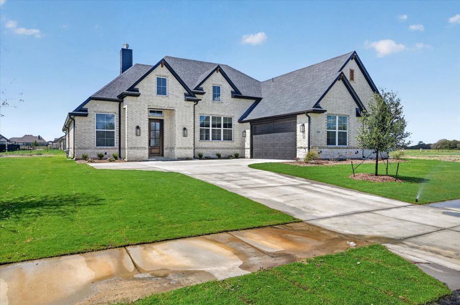 Front exterior of a new home in Paloma Ranches, Justin, TX, highlighting curb appeal (Image 23).