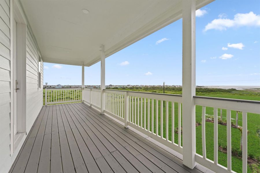 Covered back deck extends your living space with tranquil views of the bay and natural green space—no neighbors, just nature. Covered back deck extends your living space with tranquil views of the bay and natural green space—no neighbors, just nature.