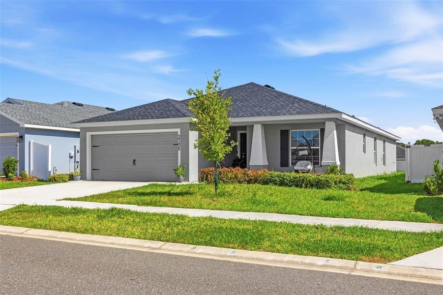 Front exterior of a new home in Astonia, Davenport, FL, highlighting curb appeal (Image 24). Front exterior of a new home in Astonia, Davenport, FL, highlighting curb appeal (Image 24).