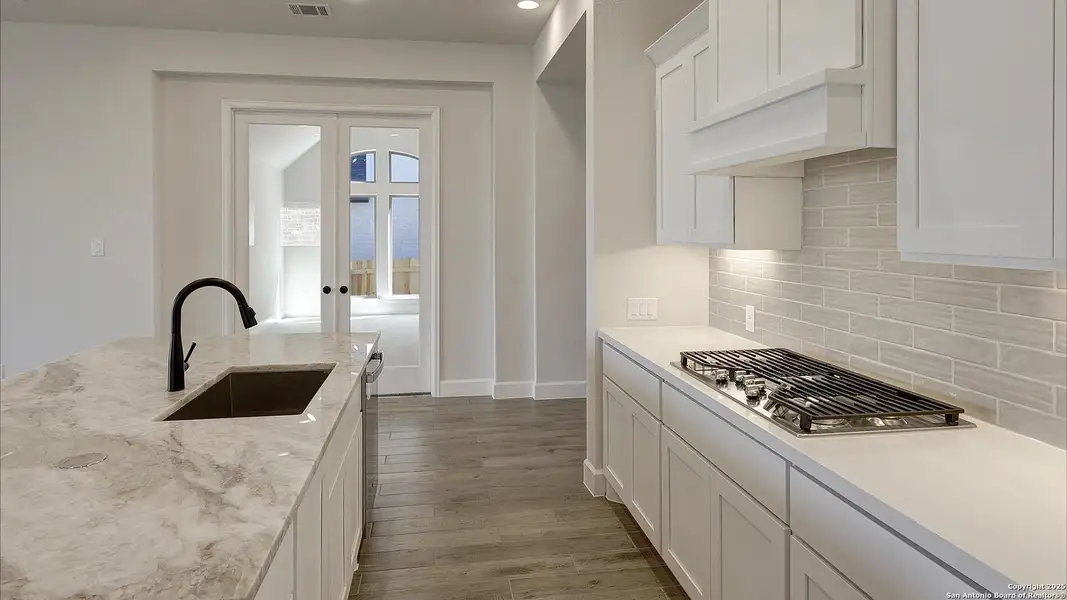 Furnished interior view inside a new home in Ladera 50', San Antonio (Image 6).