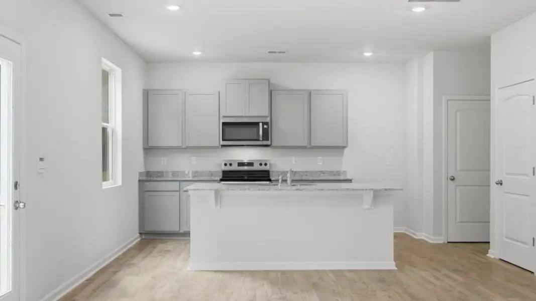 Furnished interior view inside a new home in Oaks at Cedar Grove, Fairburn (Image 5).