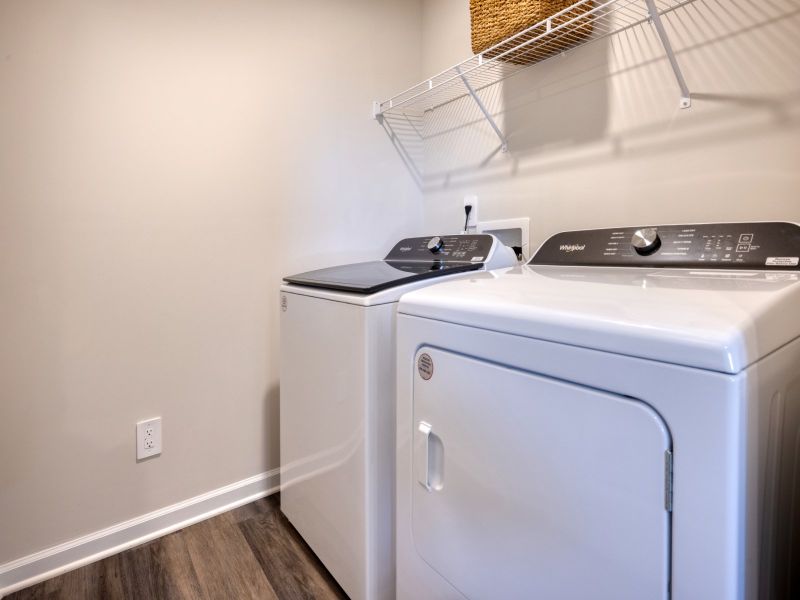 Laundry room in the Amber floorplan at a Meritage Homes community in Graham, NC.