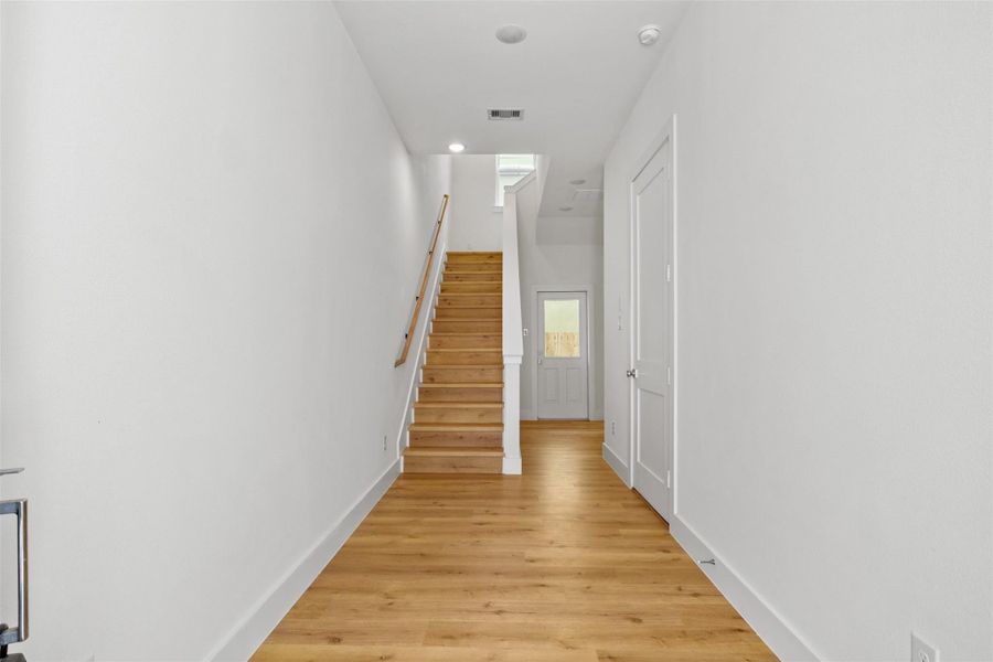 Upon entry, you're welcomed by upgraded hardwood flooring that flows seamlessly throughout the first and second levels of the home.