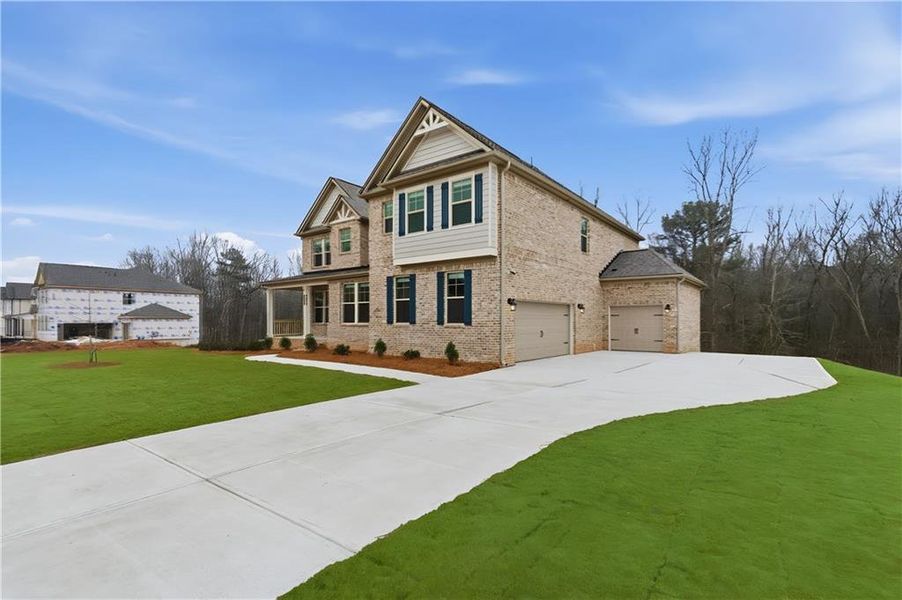Front exterior of a new home in Trinity Park, McDonough, GA, highlighting curb appeal (Image 21). Front exterior of a new home in Trinity Park, McDonough, GA, highlighting curb appeal (Image 21).