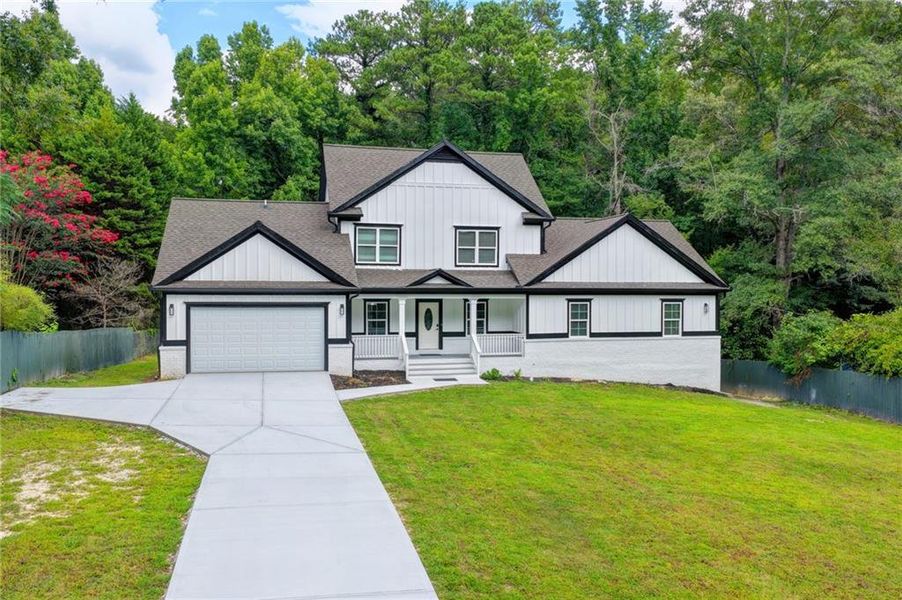 Front exterior of a new home in , Snellville, GA, highlighting curb appeal (Image 30). Front exterior of a new home in , Snellville, GA, highlighting curb appeal (Image 30).