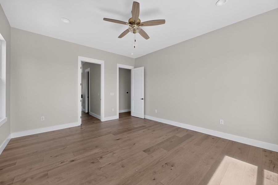Gleaming hardwood floors and clean modern trim anchor this light-filled room.