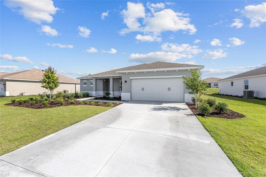 Front exterior of a new home in , Ocala, FL, highlighting curb appeal (Image 19). Front exterior of a new home in , Ocala, FL, highlighting curb appeal (Image 19).