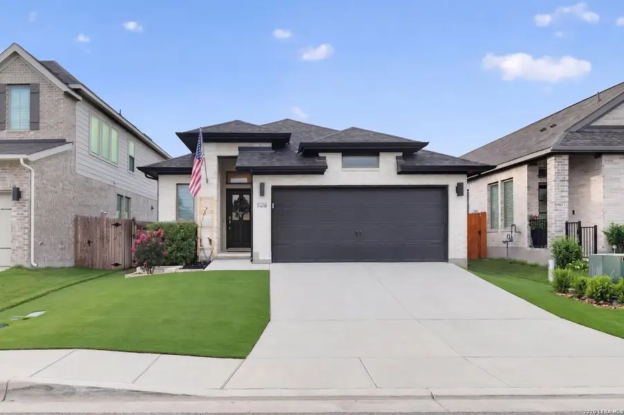 Front exterior of a new home in Veranda, San Antonio, TX, highlighting curb appeal (Image 1). Front exterior of a new home in Veranda, San Antonio, TX, highlighting curb appeal (Image 1).