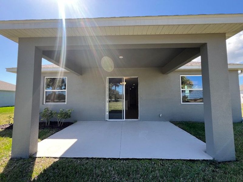 Exterior details and patio area of a home in Lakes At St Sebastian, Micco (Image 3).