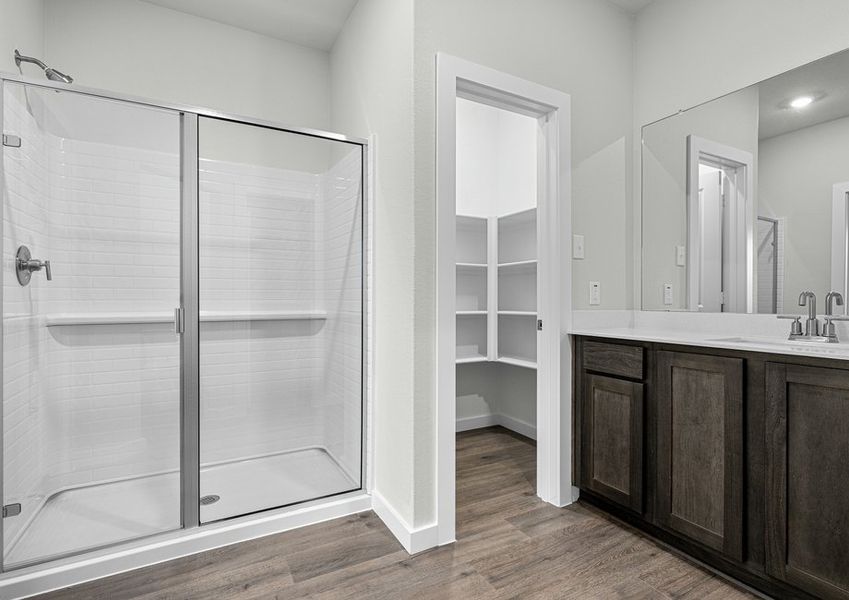 The master bathroom has a glass, walk-in shower.