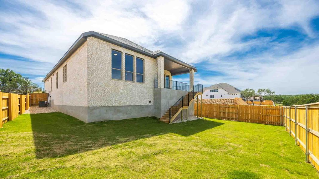 Back of property featuring stairway Back of property featuring stairway