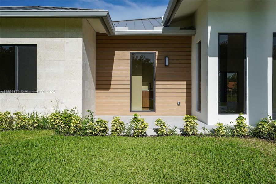 Front exterior of a new home in , Homestead, FL, highlighting curb appeal (Image 40).