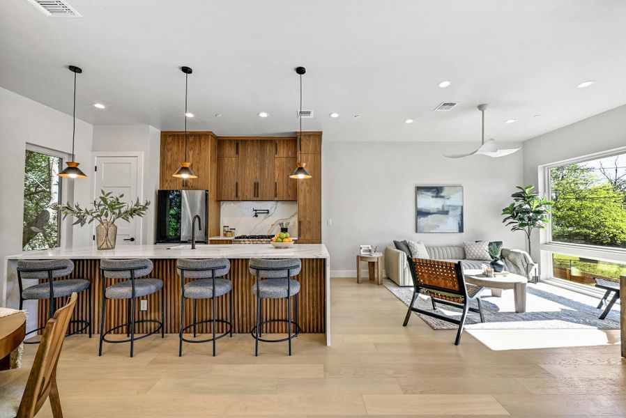 Bright and open 2nd Floor with designer accents and finishes. (This is Unit #2 - each Unit has the same layout, however a few differing details such as light fixtures, custom cabinet/backsplash/tile colors)