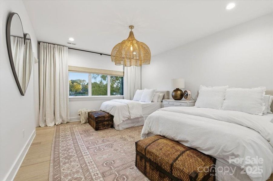 Upstairs secondary bedroom suite (Bedroom #2) with enough room for two Queen sized bed sets, hardwood flooring, ensuite bath and walk in closet. Upstairs secondary bedroom suite (Bedroom #2) with enough room for two Queen sized bed sets, hardwood flooring, ensuite bath and walk in closet.